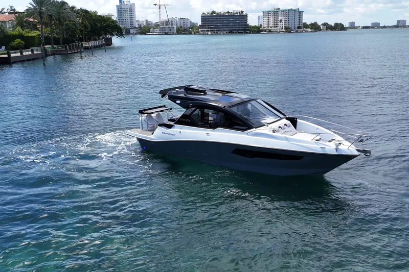 Slide: The Image of Granfort 370 GTX 2027 luxury yacht cruising on a sunny waterfront. - 7