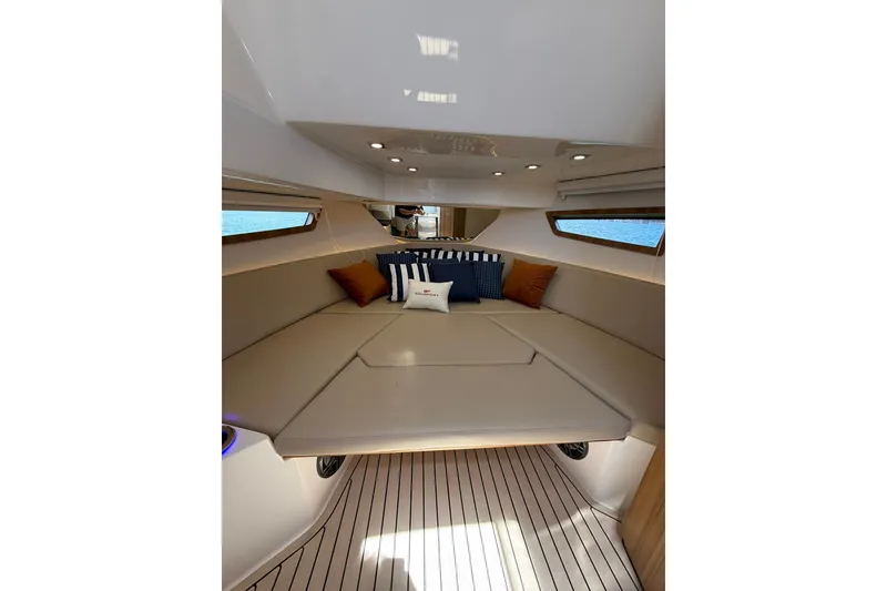 Slide: The Image of Luxurious interior of 2027 Granfort 370 GTX yacht with plush seating and cushions. - 57