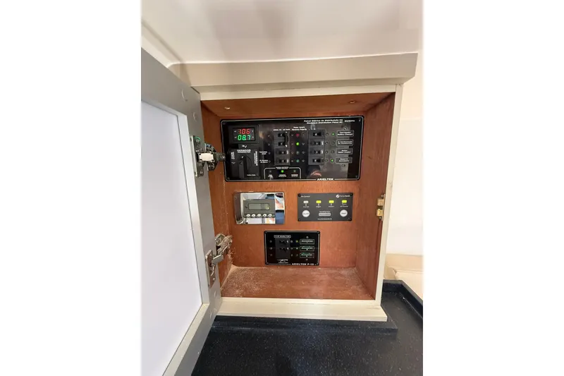 Slide: The Image of Control panel inside a 2027 Granfort 370 GTX, featuring various switches and indicators. - 66