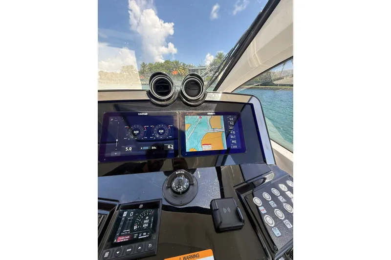 Slide: The Image of Cockpit view of 2027 Granfort 370 GTX yacht with navigation displays and controls. - 29