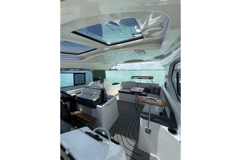 Slide: The Image of Luxurious interior of 2027 Granfort 370 GTX yacht with panoramic windows and modern seating. - 50