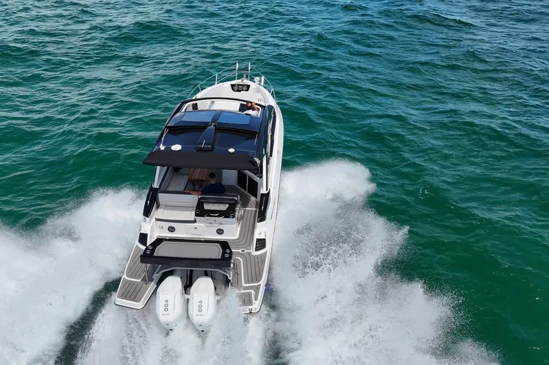 Slide: The Image of Granfort 370 GTX 2027 cruising on open water, showcasing powerful dual engines. - 3