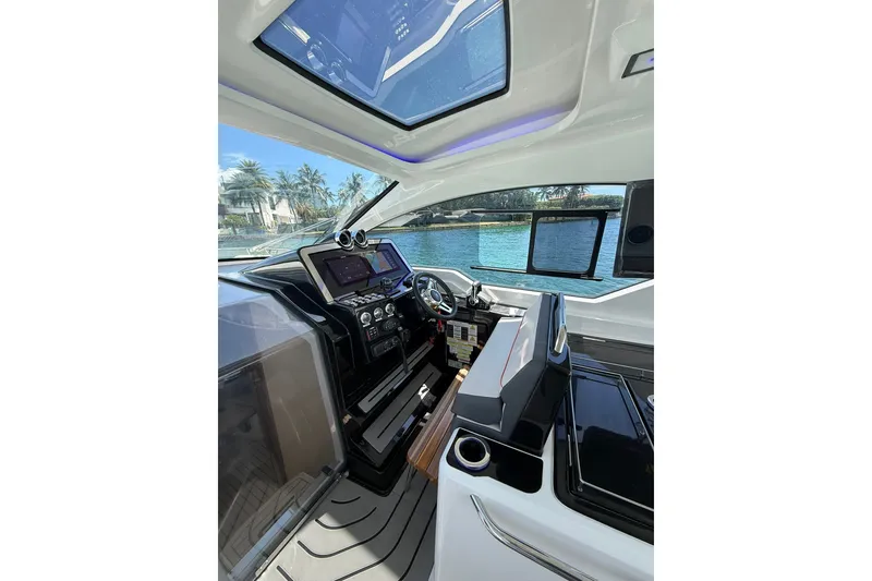 Slide: The Image of Interior of 2027 Granfort 370 GTX yacht with modern dashboard and panoramic windows. - 26