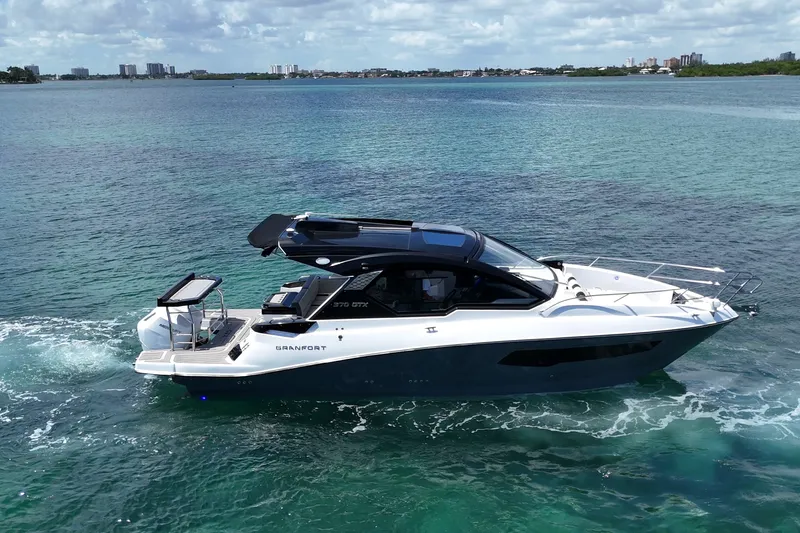 Slide: The Image of Luxury Granfort 370 GTX yacht cruising on clear blue waters, 2027 model. - 13