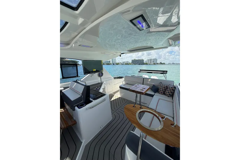 Slide: The Image of Luxurious interior of 2027 Granfort 370 GTX yacht with modern seating and scenic ocean view. - 32