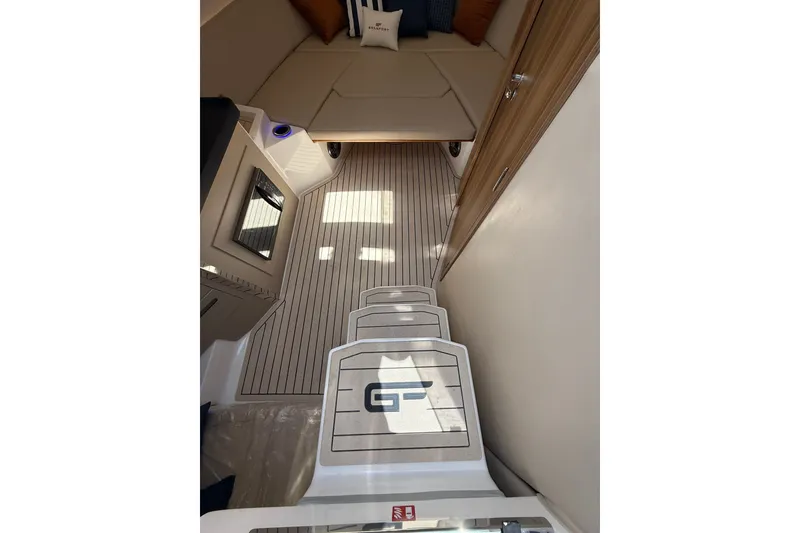 Slide: The Image of Interior of 2027 Granfort 370 GTX yacht with sleek wooden flooring and cozy seating area. - 54