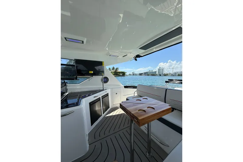 Slide: The Image of Luxurious interior of 2027 Granfort 370 GTX yacht with modern amenities and scenic water view. - 36