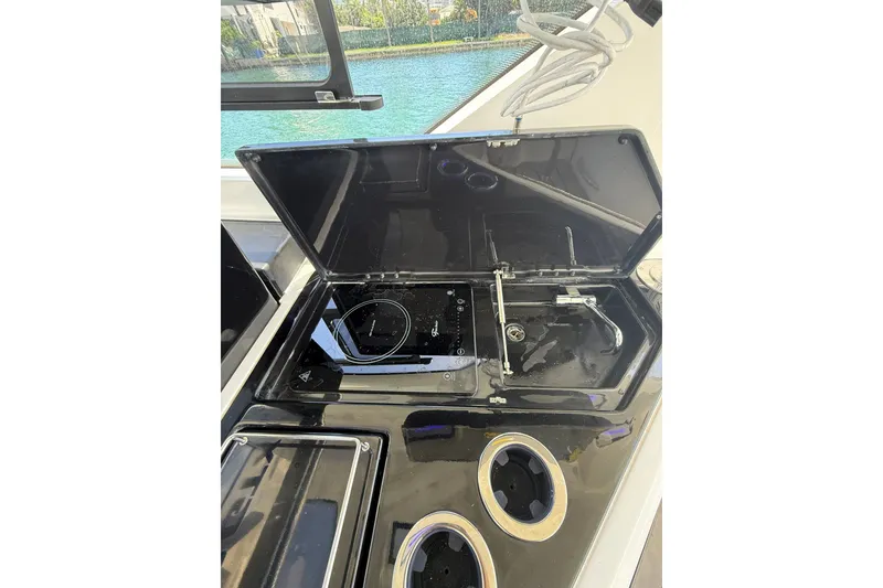 Slide: The Image of Modern kitchen setup on 2027 Granfort 370 GTX yacht, featuring sleek black appliances. - 41