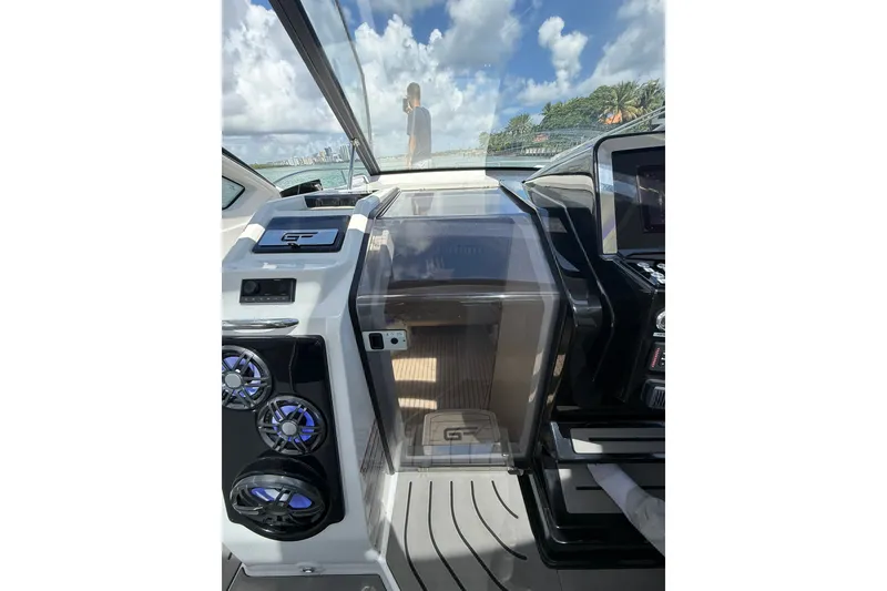 Slide: The Image of Interior view of 2027 Granfort 370 GTX yacht cockpit with modern controls and speakers. - 51
