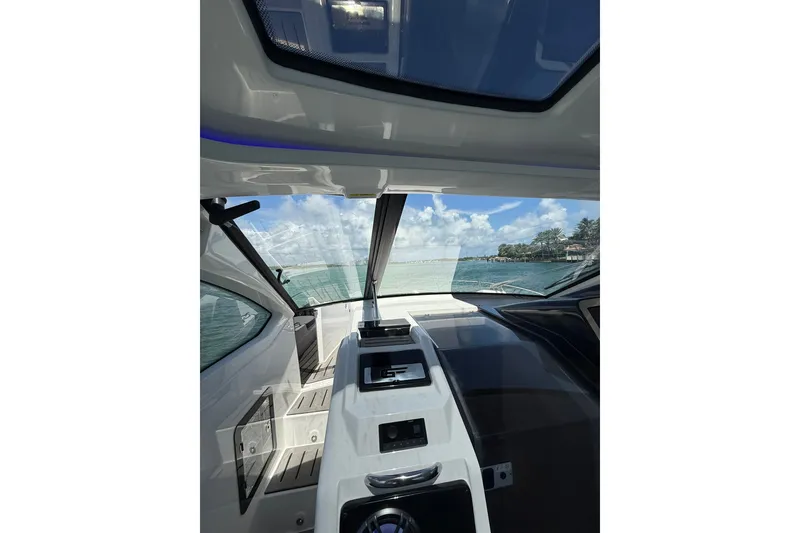 Slide: The Image of Interior view of 2027 Granfort 370 GTX yacht, showcasing sleek design and ocean scenery. - 43