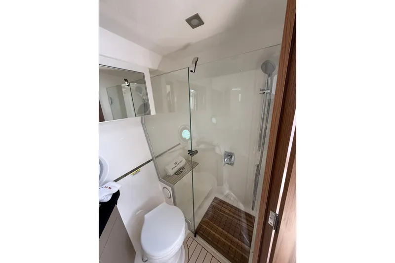 Slide: The Image of Modern bathroom in 2027 Granfort 370 GTX yacht with glass shower and wooden accents. - 64