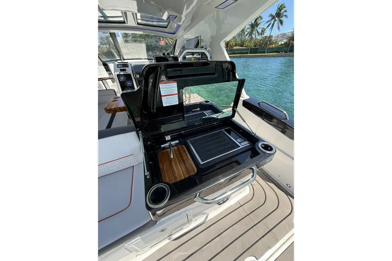 Slide: The Image of Luxury 2027 Granfort 370 GTX yacht with sleek outdoor grill and scenic water view. - 19