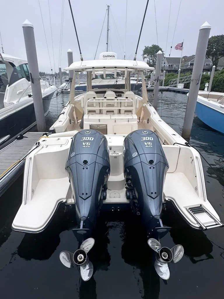 Slide: The Image of 2022 Grady-White Canyon 326 boat with twin Yamaha 300 HP engines docked. - 14
