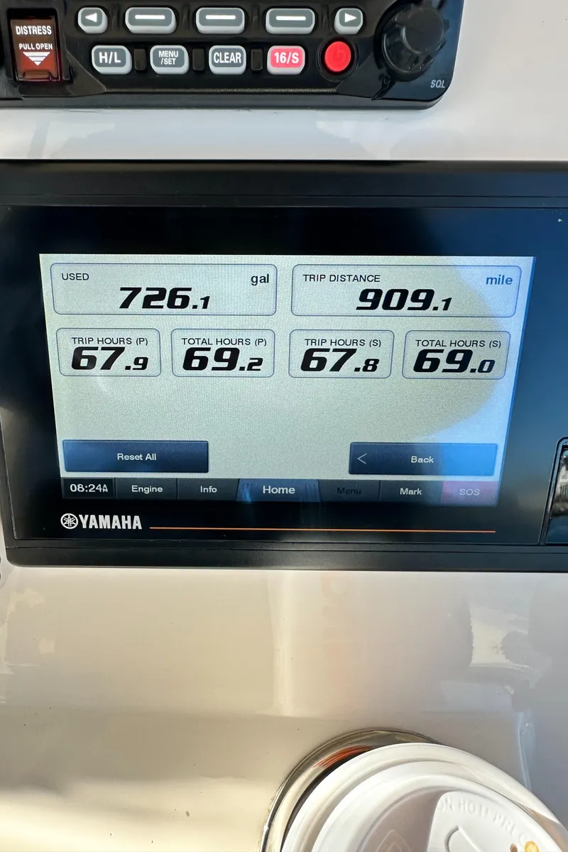 Slide: The Image of Yamaha display on 2022 Grady-White Canyon 326 showing fuel usage and trip distance. - 35