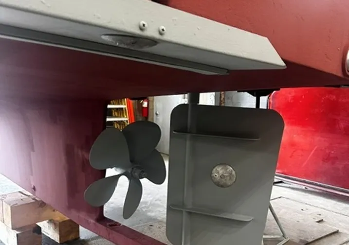 Slide: The Image of Close-up of the propeller and rudder of a 1998 BHM boat finished by Wilbur Yachts. - 23