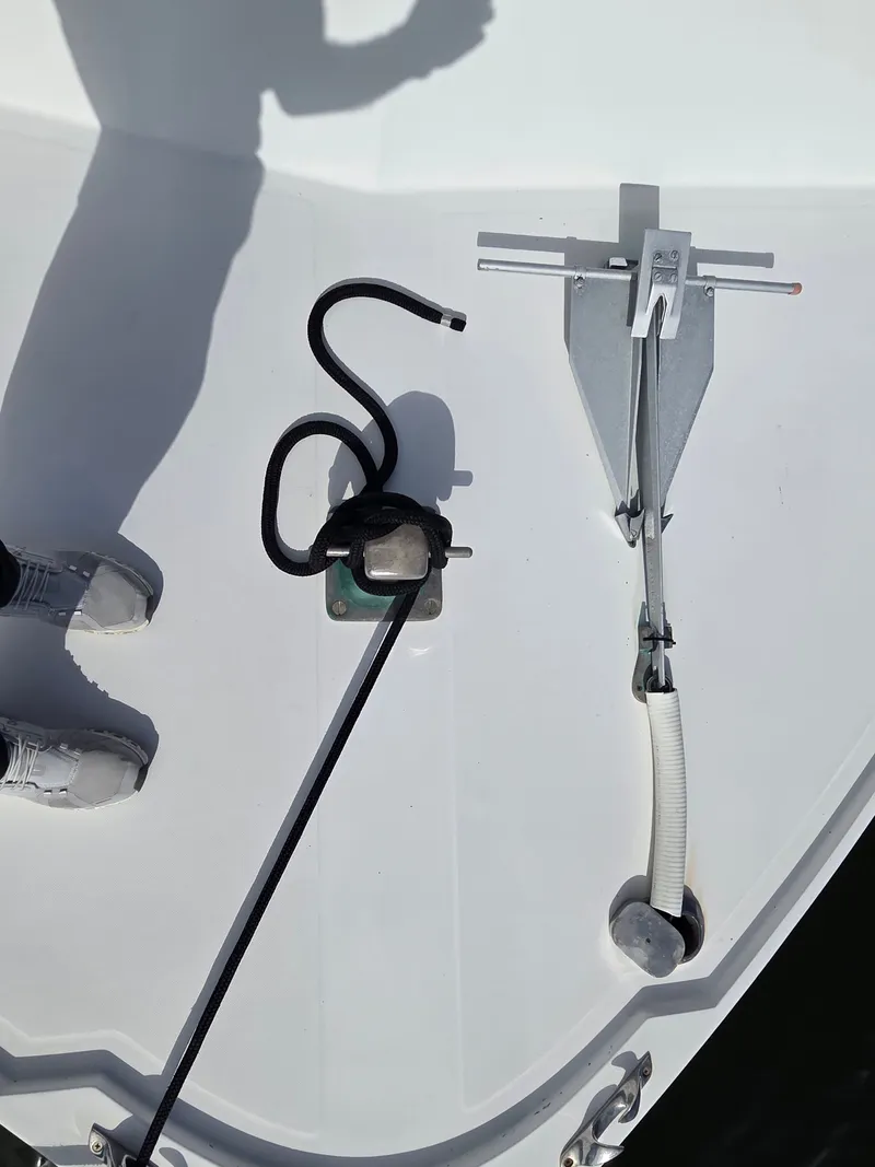 Slide: The Image of The image shows a boat deck with an anchor and a rope. - 8