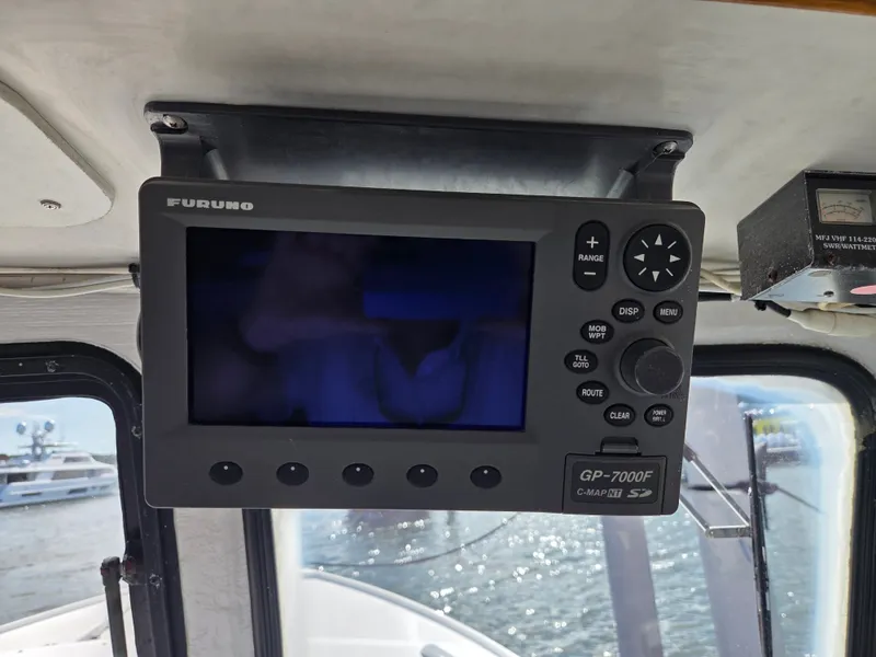 Slide: The Image of A Furuno GP-7000F navigation system is mounted in a boat's wheelhouse. - 20