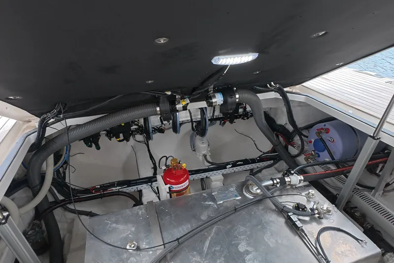 Slide: The Image of Engine compartment of 2025 Schaefer V44 yacht, showcasing mechanical components and wiring. - 22