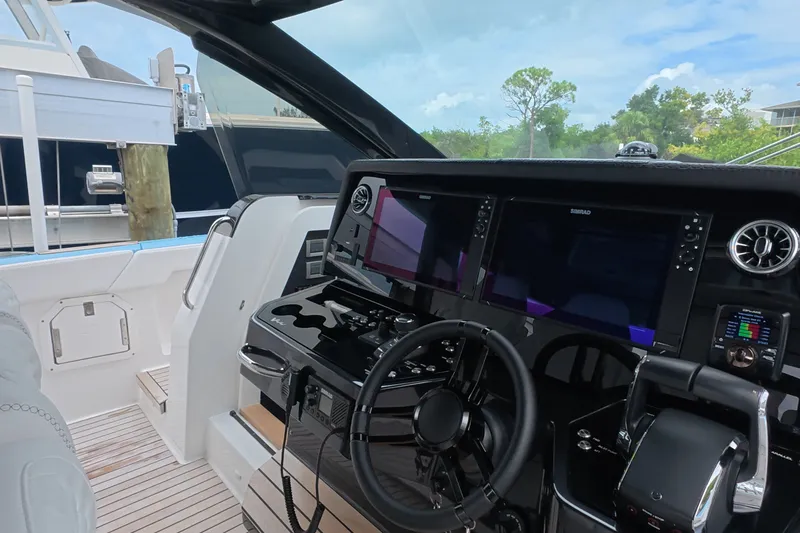 Slide: The Image of Modern helm of 2025 Schaefer V44 yacht with advanced navigation displays. - 43
