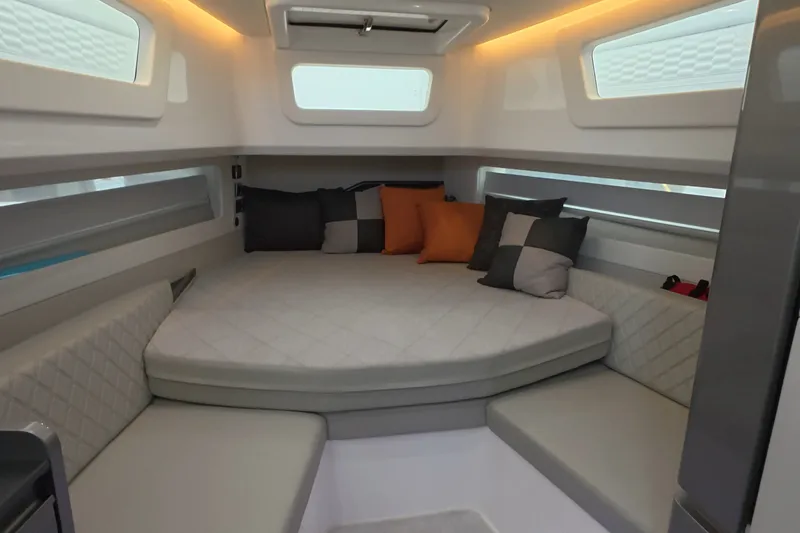 Slide: The Image of Luxurious interior of 2025 Schaefer V44 yacht with modern seating and cushions. - 17