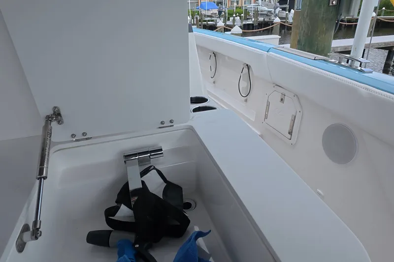 Slide: The Image of 2025 Schaefer V44 yacht interior with storage compartment and dock view. - 35
