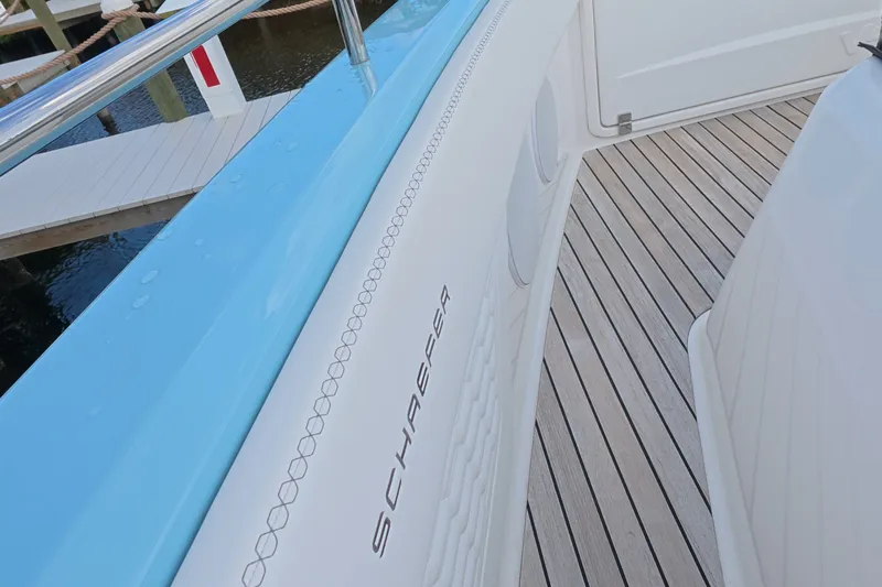 Slide: The Image of Schaefer V44 yacht deck, 2025 model, featuring sleek design and wooden flooring. - 57