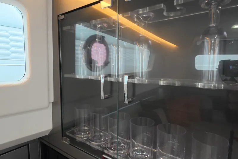 Slide: The Image of Glass cabinet interior on 2025 Schaefer V44 yacht, showcasing elegant glassware. - 47