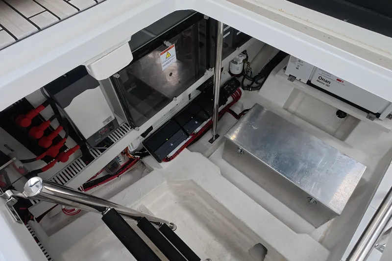 Slide: The Image of Engine compartment of 2025 Schaefer V44 yacht, featuring modern equipment and organized wiring. - 61