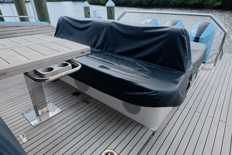 Slide: The Image of Deck of 2025 Schaefer V44 yacht with covered seating and table. - 51