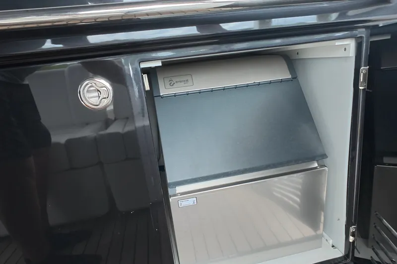 Slide: The Image of Open compartment on Schaefer V44 yacht, showcasing a built-in Everest appliance, 2025 model. - 32