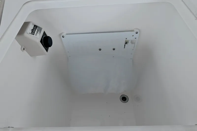 Slide: The Image of Interior of Schaefer V44 (2025) boat compartment with control panel and drainage. - 34