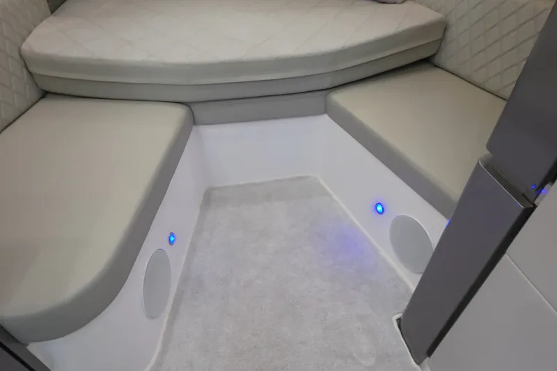 Slide: The Image of 2025 Schaefer V44 interior cabin with cushioned seating and ambient lighting. - 18
