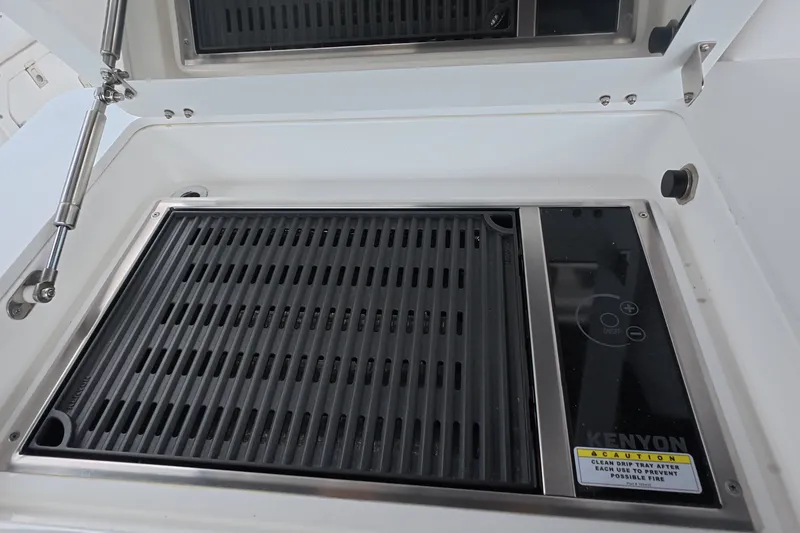 Slide: The Image of Built-in Kenyon grill on 2025 Schaefer V44 yacht, featuring sleek design and modern controls. - 33
