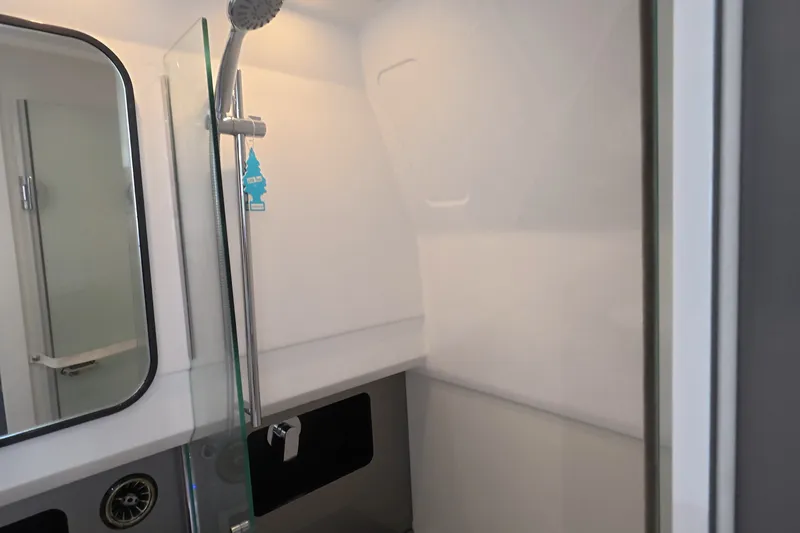 Slide: The Image of Modern bathroom interior of Schaefer V44 yacht, featuring sleek shower design, 2025 model. - 20