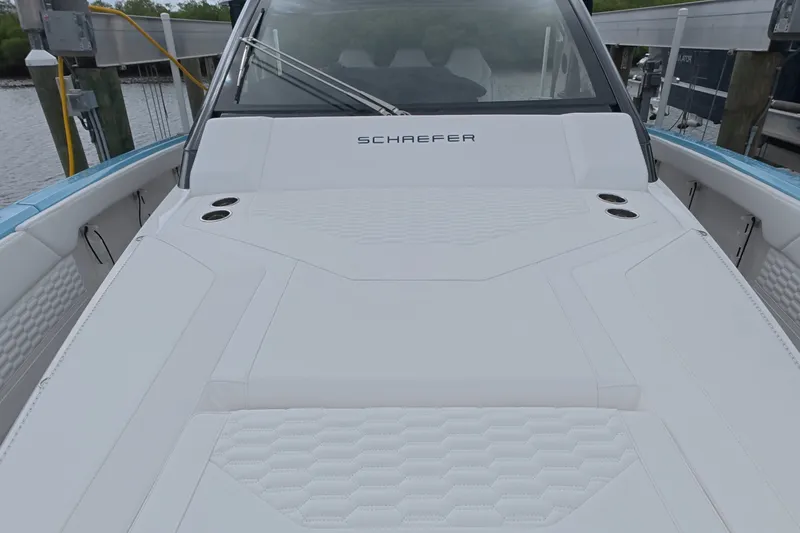 Slide: The Image of 2025 Schaefer V44 yacht with sleek white deck and modern design. - 16
