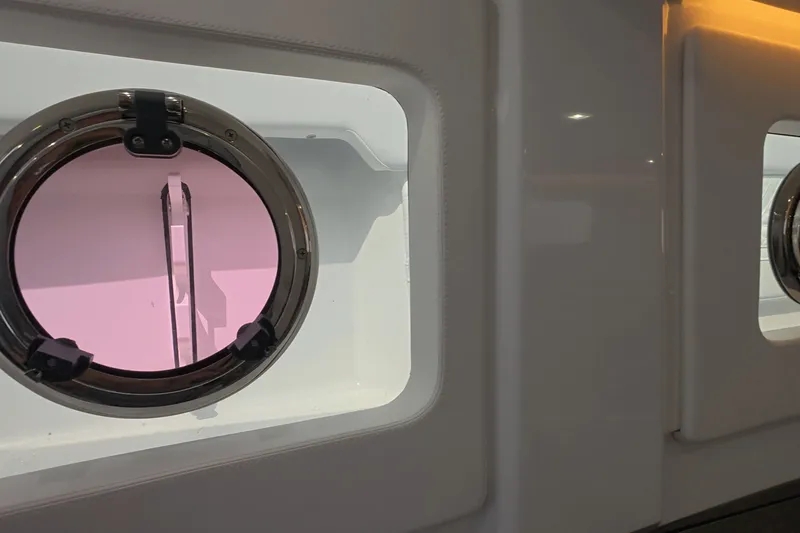 Slide: The Image of Porthole view inside 2025 Schaefer V44 yacht, featuring sleek interior design. - 44