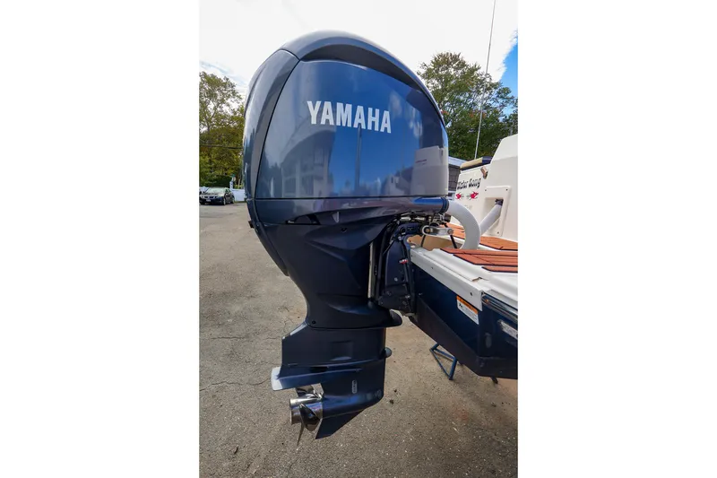 Slide: The Image of Yamaha outboard motor on 2023 Ranger Tugs R-27 boat, parked outdoors. - 46