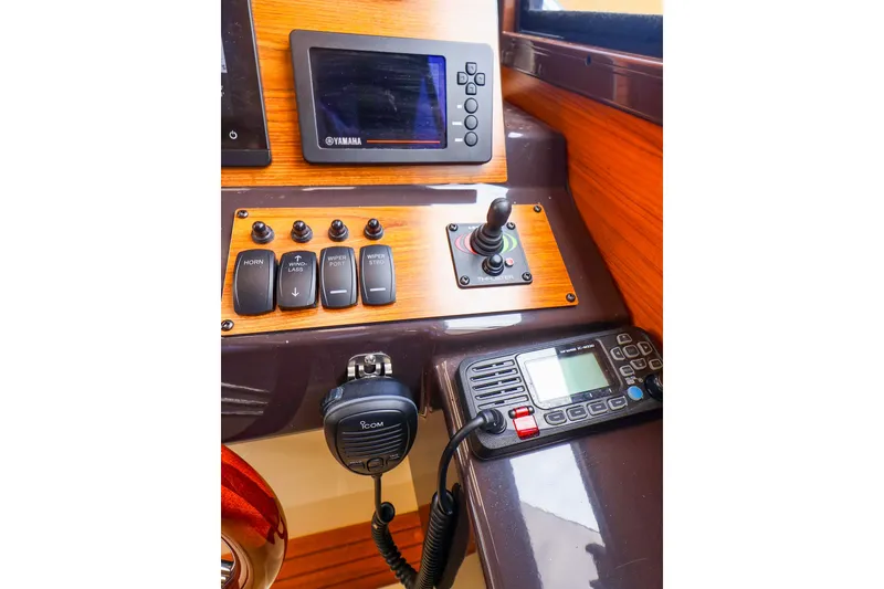 Slide: The Image of Control panel of 2023 Ranger Tugs R-27 with Yamaha display and communication equipment. - 31