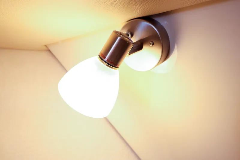Slide: The Image of Interior light fixture on 2023 Ranger Tugs R-27 boat, illuminating cabin space. - 36