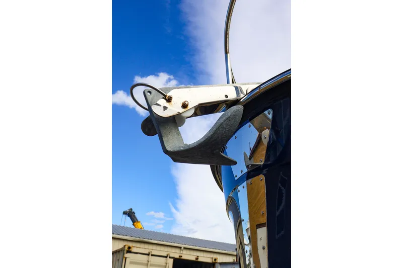 Slide: The Image of 2023 Ranger Tugs R-27 boat anchor against a clear blue sky. - 13