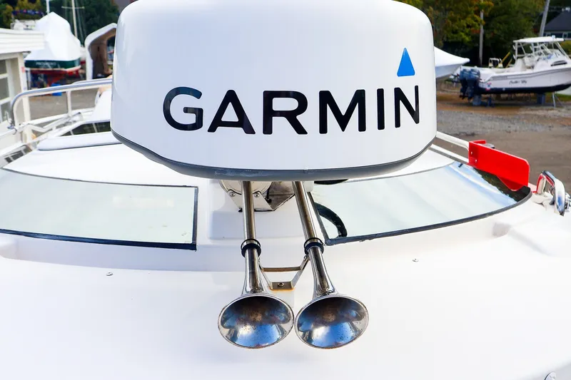 Slide: The Image of 2023 Ranger Tugs R-27 boat with Garmin radar and dual horns on deck. - 15