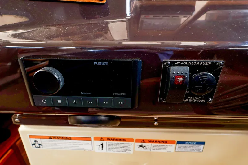 Slide: The Image of Control panel of 2023 Ranger Tugs R-27 with Fusion audio and Johnson pump. - 37