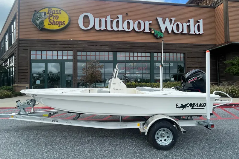 The Image of 2026 Mako 18 Pro Skiff boat on trailer outside Bass Pro Shops Outdoor World. - 0
