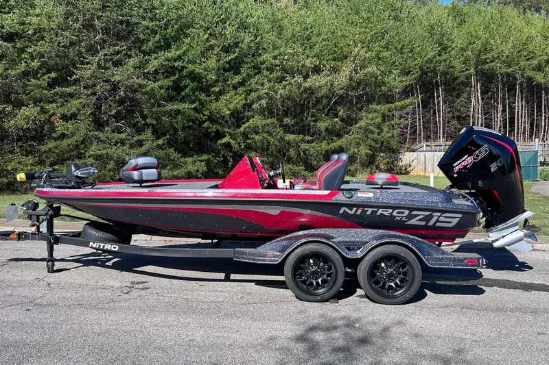 Slide: The Image of 2027 Nitro Z19 XL Pro bass boat on trailer, parked outdoors. - 1