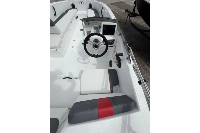 Slide: The Image of 2027 Tahoe T18 boat interior with steering wheel and seating. - 16
