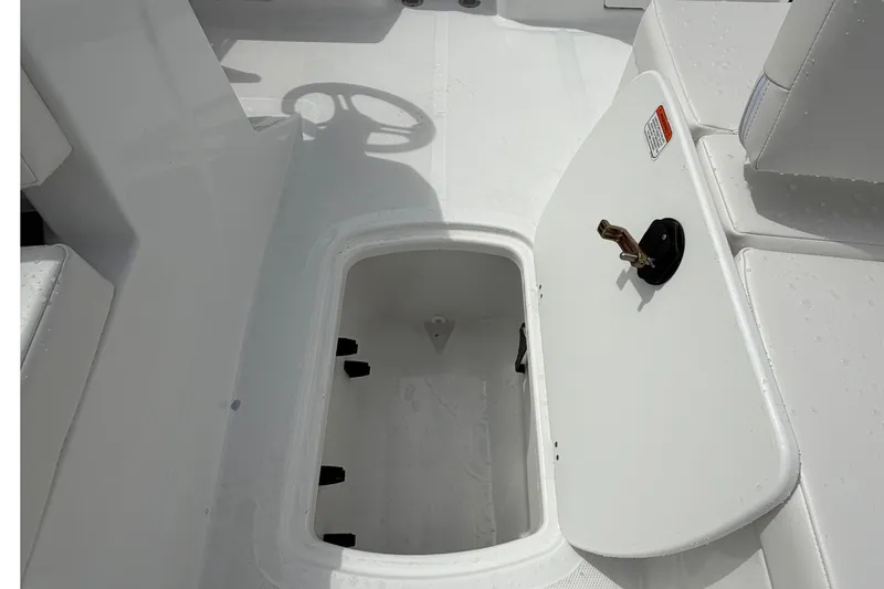 Slide: The Image of 2027 Tahoe T18 boat interior with open storage compartment and seating area. - 10