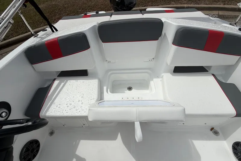Slide: The Image of 2027 Tahoe T18 boat interior with white and gray seating, featuring red accents. - 13