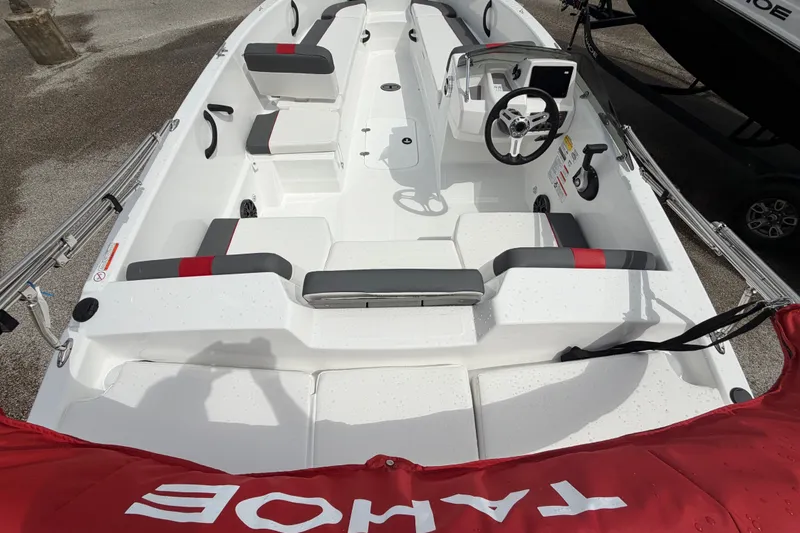 Slide: The Image of 2027 Tahoe T18 boat interior with modern seating and steering console, viewed from above. - 8