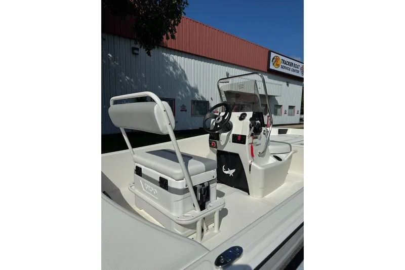 Slide: The Image of 2027 Mako Pro Skiff 17 CC boat interior with steering console and seating. - 8