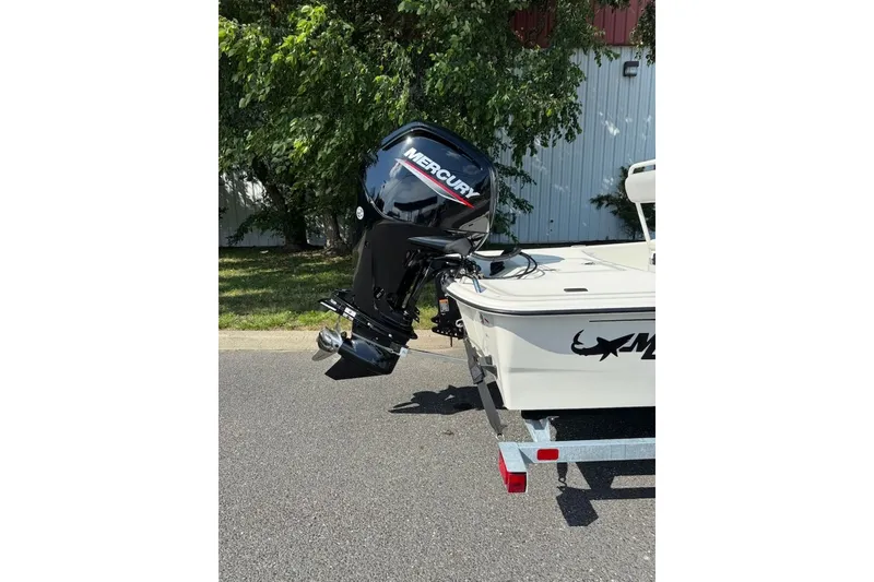 Slide: The Image of 2027 Mako Pro Skiff 17 CC with Mercury outboard motor on trailer. - 4
